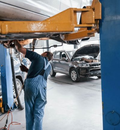 Close-up of a detailer cleaning a vehicle interior
